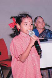 A child from the school holds centrestage at the inaugural function.