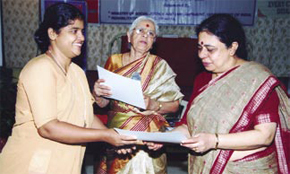 Poonam Natarajan distributing participation certificates