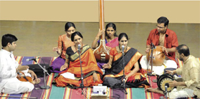 A typical Carnatic music concert, featuring vocalist sisters Ranjani and Gayatri. A percussion solo interlude is in progress (see the left handed mridangam player Arun Prakash, and the ghatam or mudpot player), the tambura, a drone to maintain the pitch, and the violin, given a rest by the violinist whilehe is keeping the beat for the percussionists