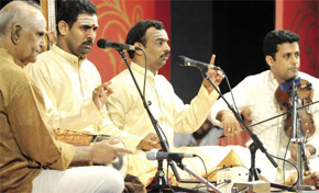 Accompanying the well known vocalists, the Malladi Brothers, is Umayalpuram Sivaraman who plays the mridangam (a percussion instrument) and received the Sangita Kalanidhi award, the highest honour in Carnatic music