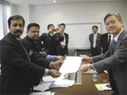 Capt K Rajasekaran and VS Ramesh receiving the sale documents of Sanmar Stanza from her Japanese owners.