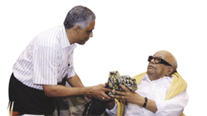 V Alagappan presenting a shawl to the Honourable Chief Minister