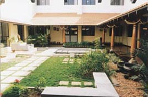 beside the traditional Chettinad-style central courtyard