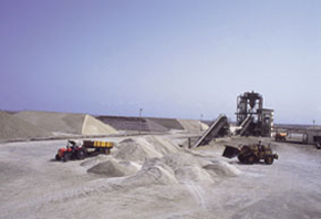 The JCB machine forming salt heaps for storage