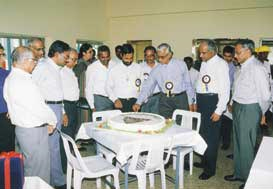 M S Sekhar seen cutting the cake as guests look on